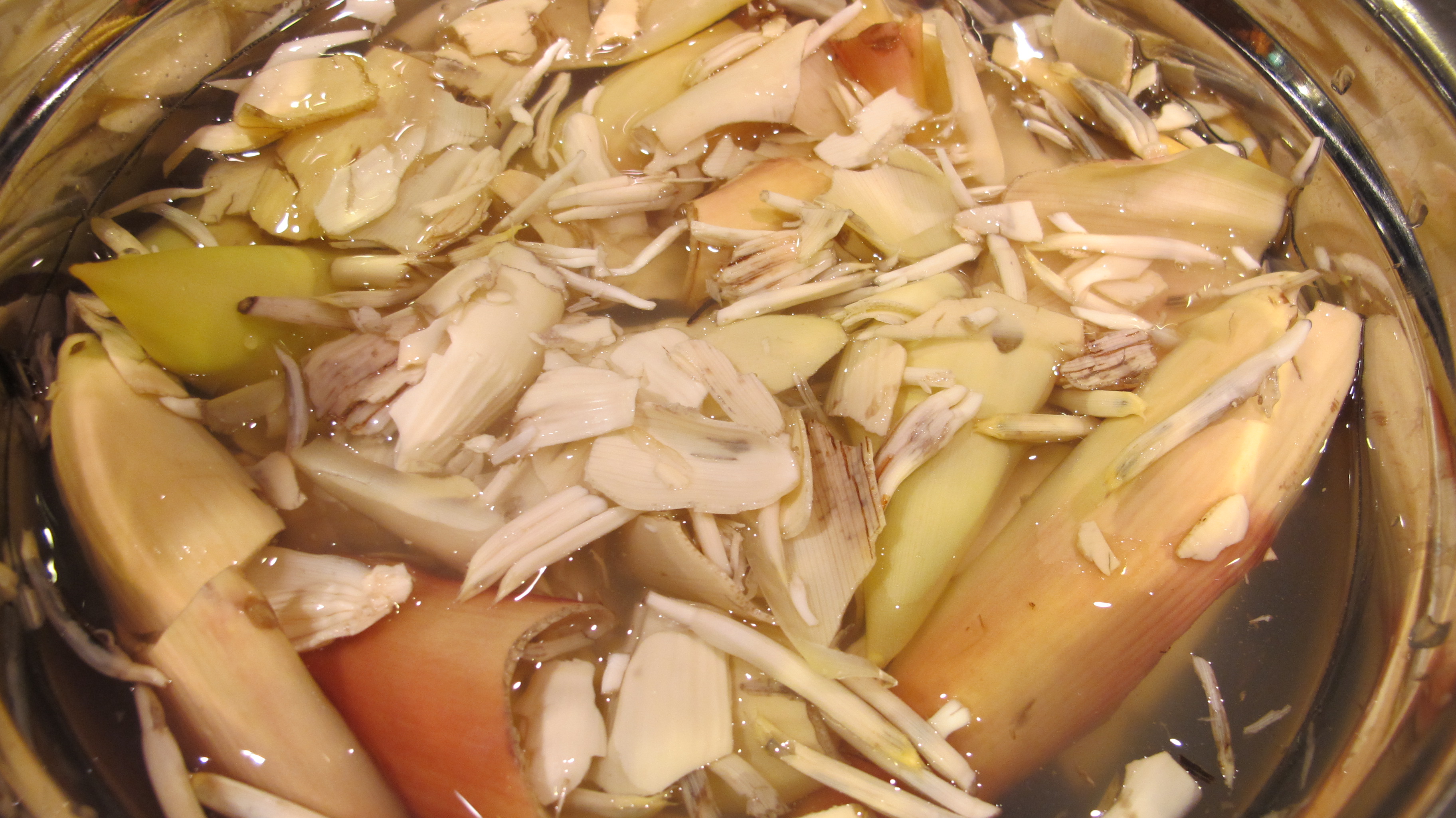The banana flower soaks in lemon water before being cut to serve. 