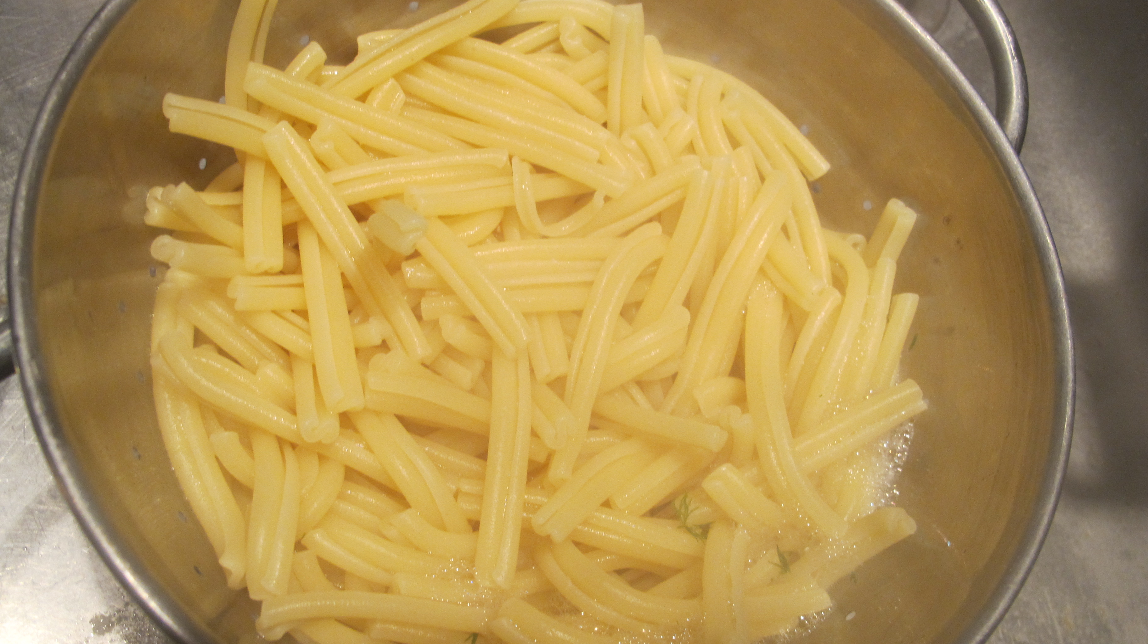 I used "strozzapreti" pasta. The translation to english is "choked preist". It may be difficult to find in stores. 
