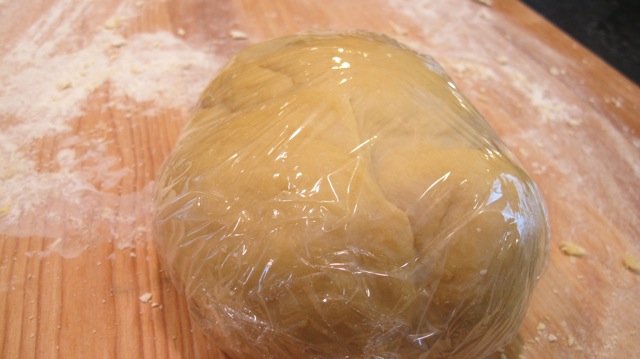 After kneading, the dough is given a 30 minute break wrapped in plastic. 
