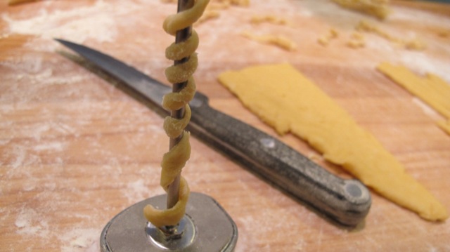 ...And coiled those strips to make a long, flat fusili. 