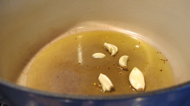 Sautee the garlic in olive oil and garlic over low heat. 