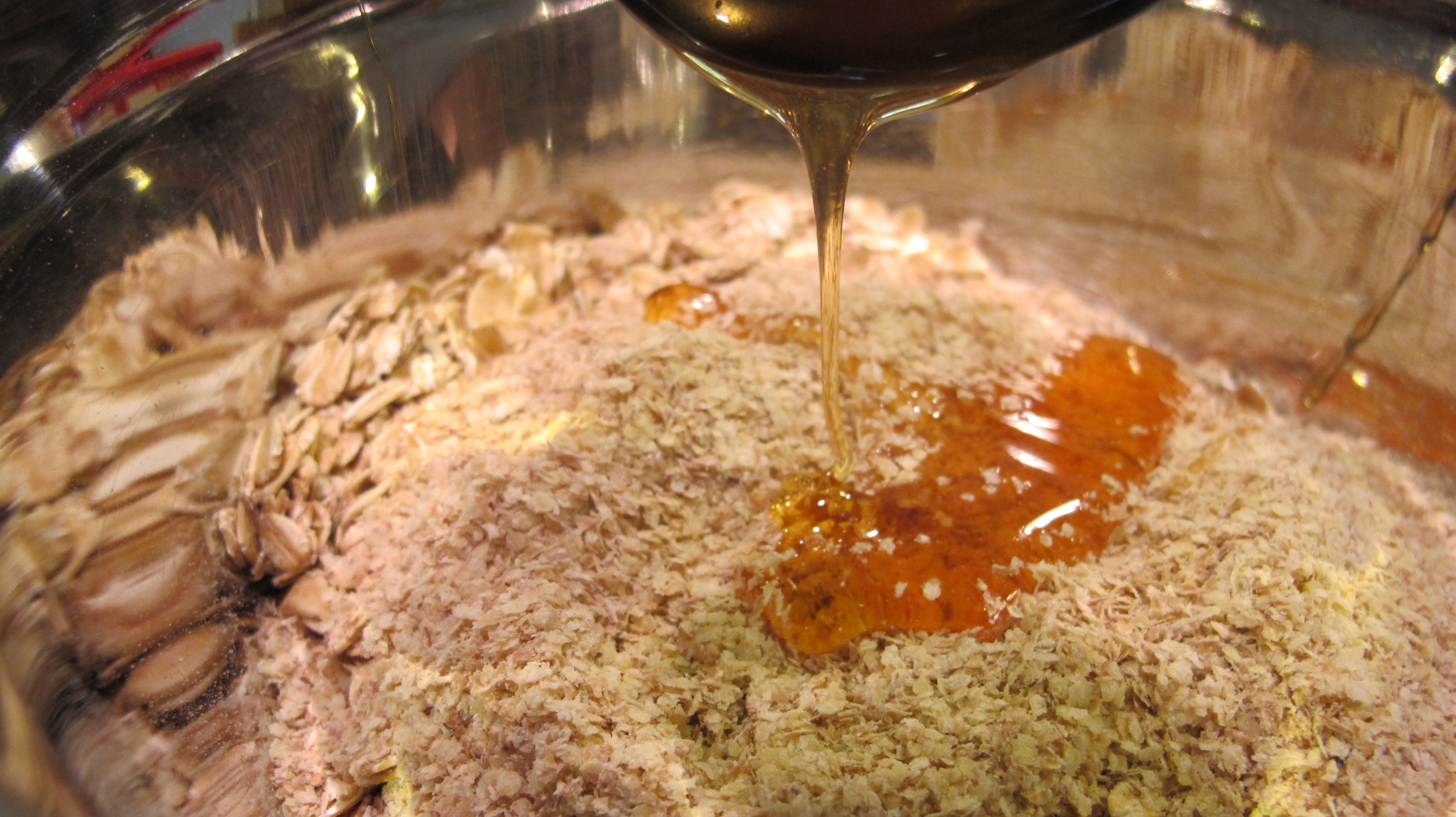 Honey is added to the dry ingredients. 