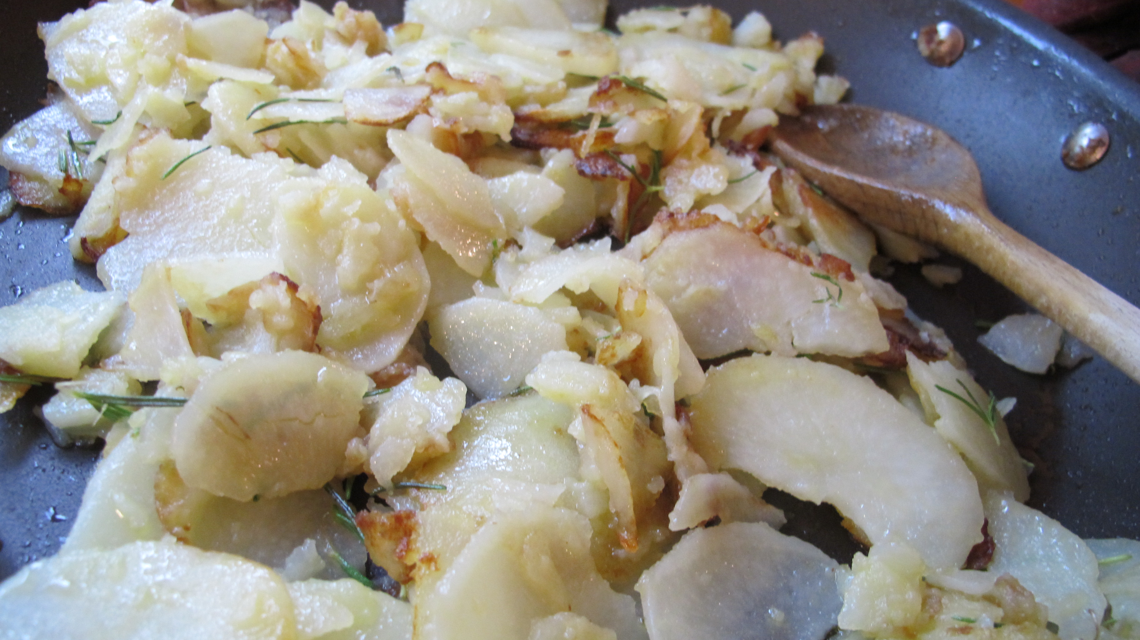 Pan-fry the potatoes until they are slightly golden brown. 