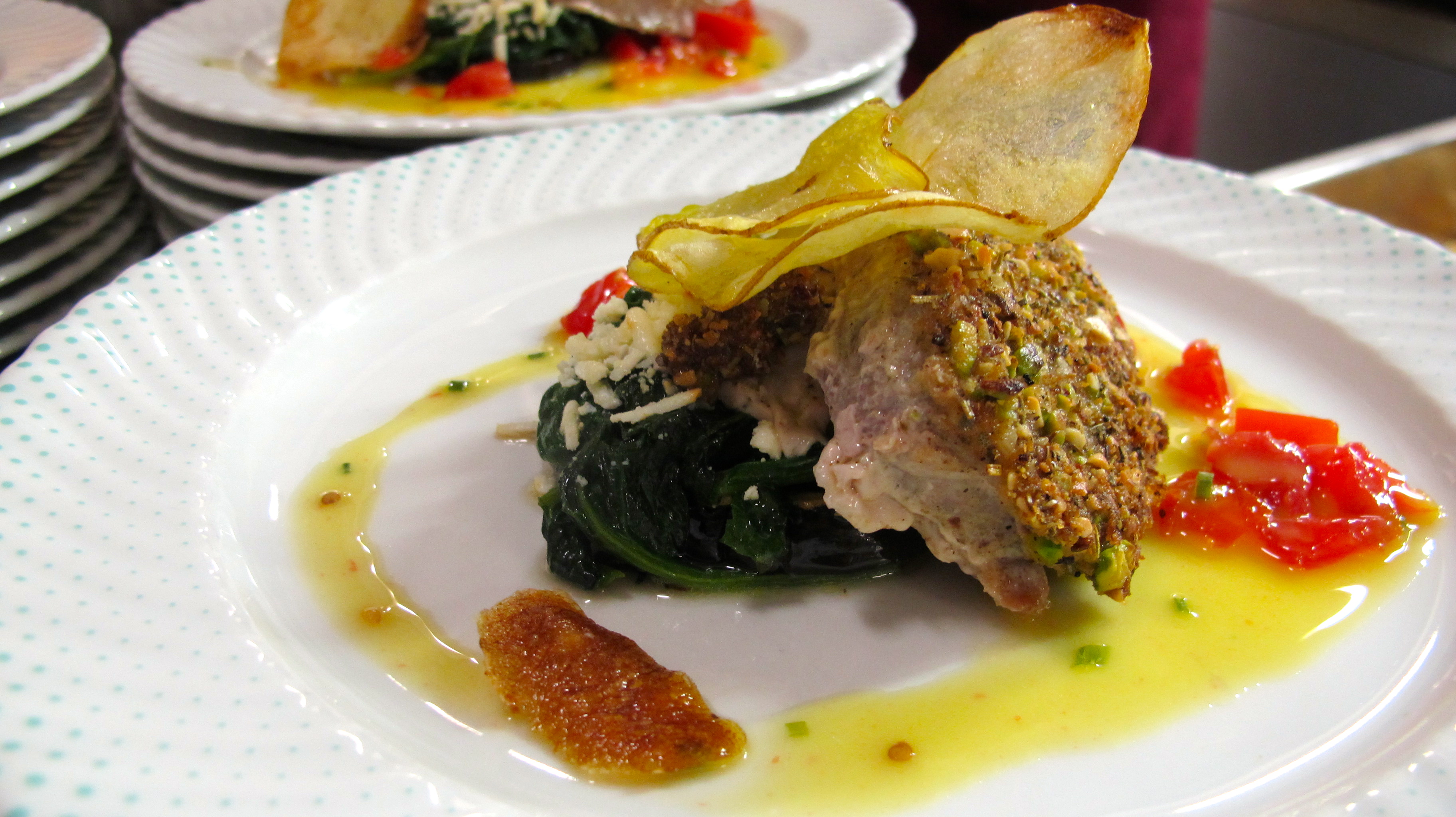 Tuna in a pistachio crust with spinach, tomatoes, and tropical sauce, and house-cut potato chips. I did the chips and diced the tomatoes, thank you very much. 