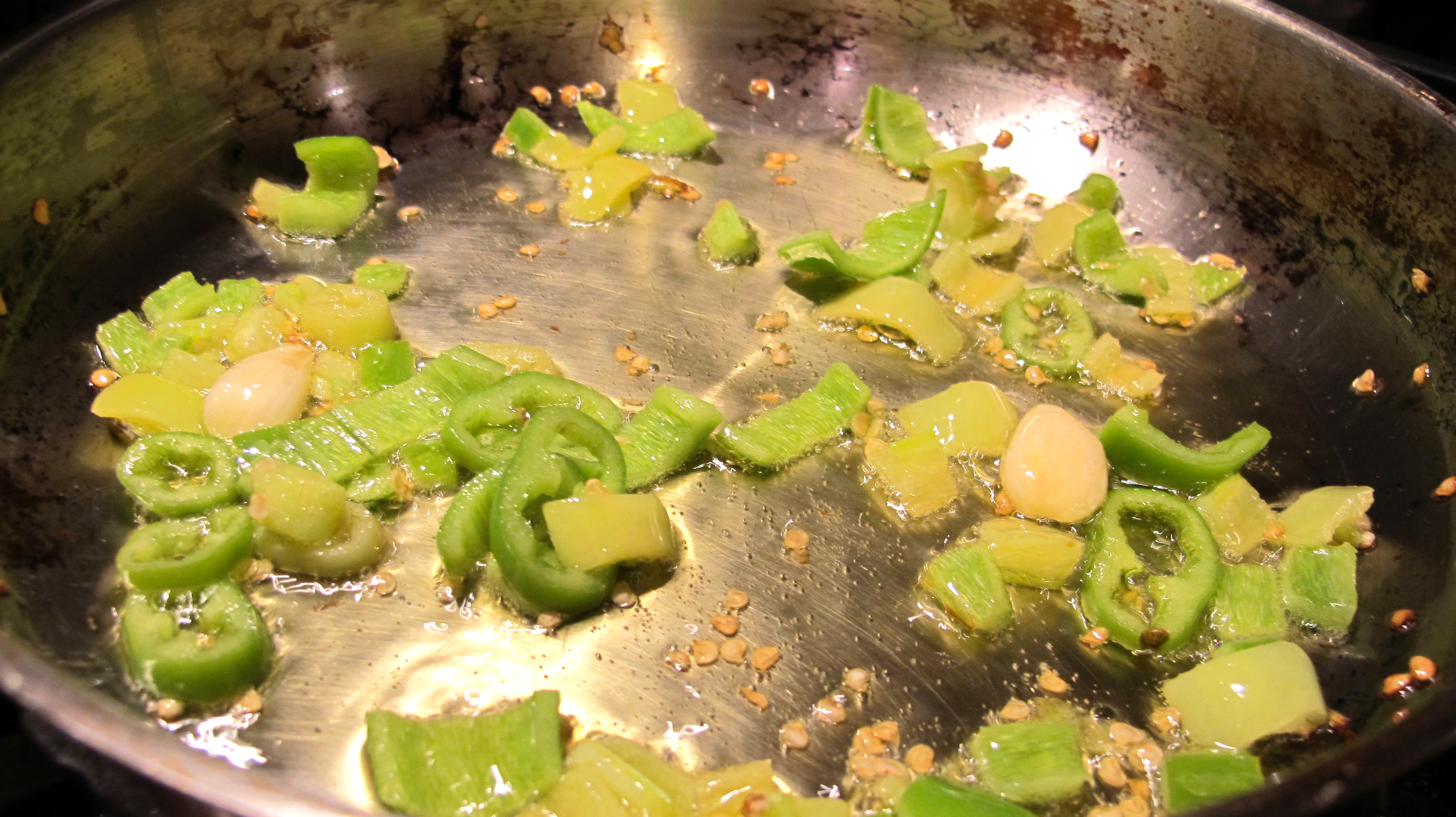 Sauté the green pepper in olive oil with garlic. 