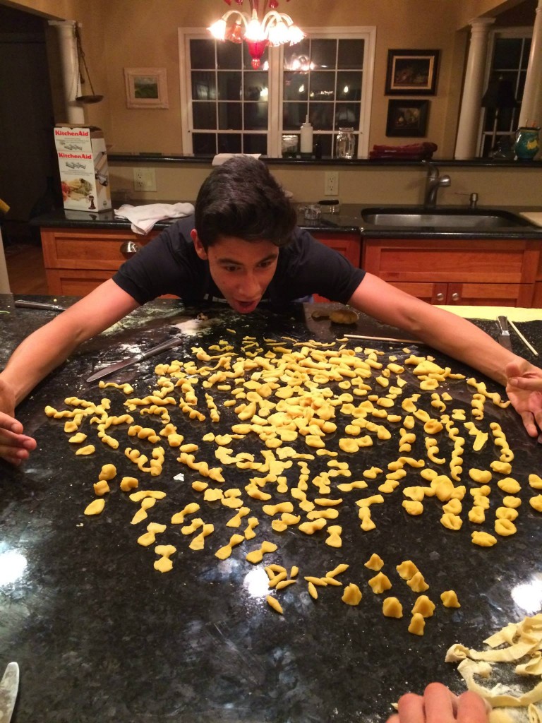 Andrew (peer buddy) bows down to the beautiful pasta shapes he helped make. 