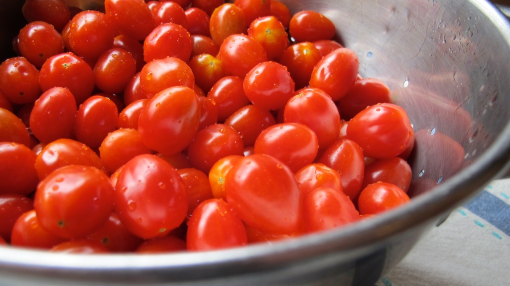 Wash the cherry tomatoes (of course), and then slice each one in half. 