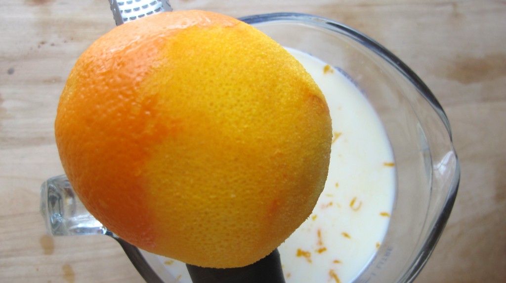 Zest an orange and a lemon. 