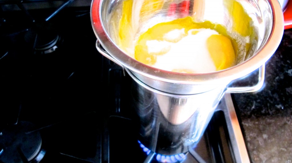 Slowly whisk the egg yolks and sugar on heat until cream is formed. 