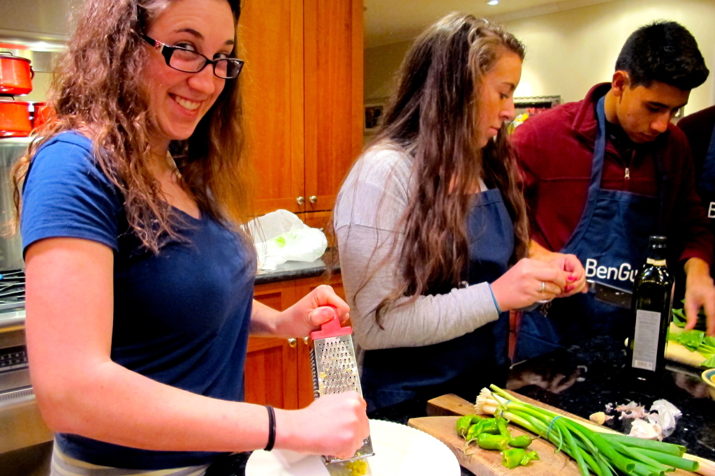 Penny grates ginger, while Aly and Andrew prepare the bok choy (a Chinese cabbage cousin). 