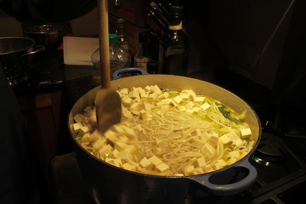 The noodles are in, the tofu is added, and the pot is ready to be brought to the table. 
