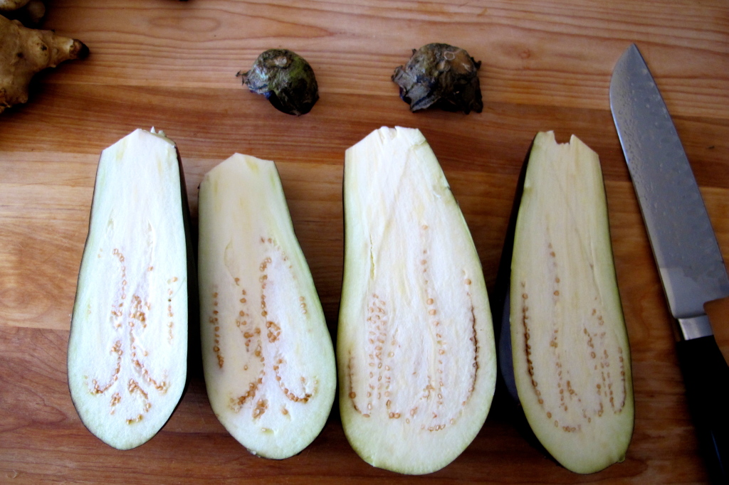 Split the eggplants lengthwise down the middle. 